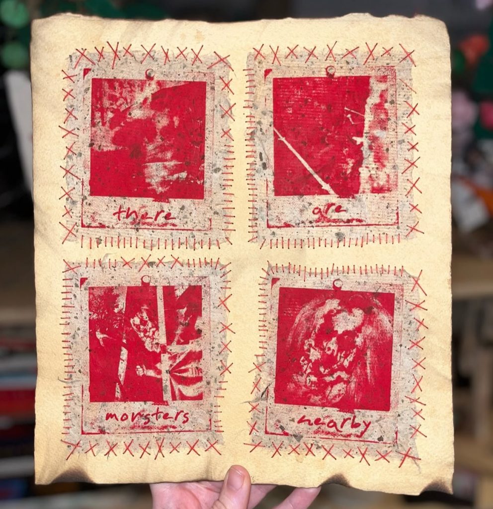 A textured page featuring four red-tinted images arranged in a grid, each with captioned labels: 'there', 'are', 'monsters', and 'nearby'. The images appear abstract and artistic, with a handmade quality, set against a beige background.